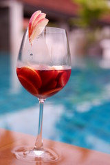 Red wine sangrai at poolside bar