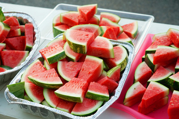 watermelon cut in pieces in the container for the event