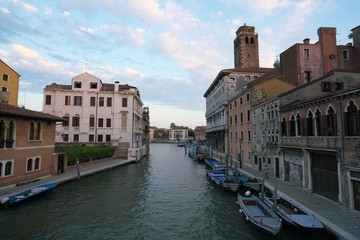 Naklejka premium Venice,Italy-July 24, 2018 : Houses and shops near Guglie bridge on Cannaregio canal, Venice 