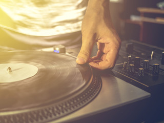 close up vintage look of dj playing vinyl record music on the party