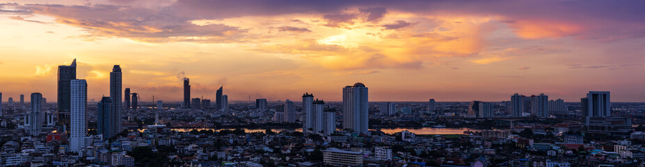 Fototapeta na wymiar panorama of metropolis urban cityscape beside the river and cloudscape