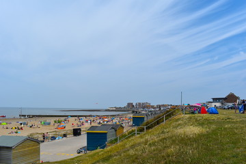 Beachgoers making the most of the sunshine at Minnis Bay over the weekend. Birchington, Kent, England