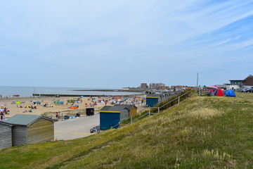 Obraz premium Beachgoers making the most of the sunshine at Minnis Bay over the weekend. Birchington, Kent, England