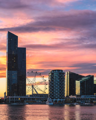 Melbourne wheel spins under a stunning Melbourne sunset in Docklands