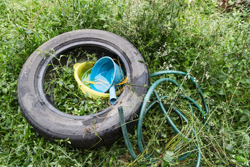 Standing water trapped in tire and containers breed mosquito