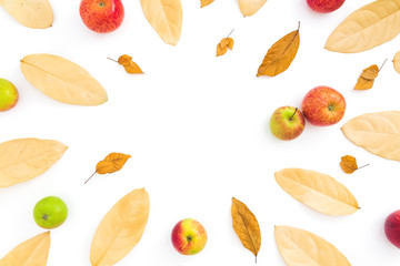 Thanksgiving composition. Frame of autumn dried leaves and apple fruits on white background. Flat lay, top view, copy space
