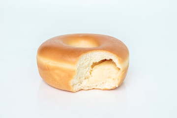 Bite marks on donuts on white background