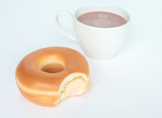 Bite marks on donuts and cup cocoa drink on white background