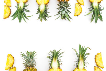 Food frame of juicy pineapple fruits on white background. Flat lay, top view. Food concept.