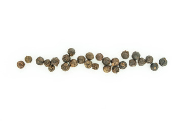 black peppercorns heap top view on white background.