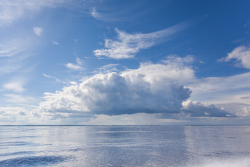 Fototapeta premium Cumulus white clouds over the water surface of Ladoga Lake. Karelia. 