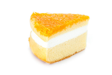 Slice of delicious orange cake on white background.