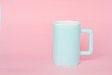 blue mug on a pink background