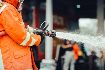 Firefighters training ,firefighters spray water to fire