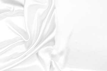 White silk texture luxurious satin for abstract background. beautiful white fabric, soft focus