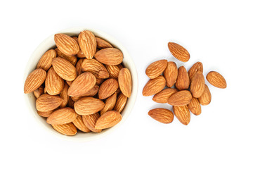 almonds in white bowl top view on white background.