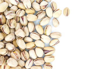 pistachio top view frame or border on white background.