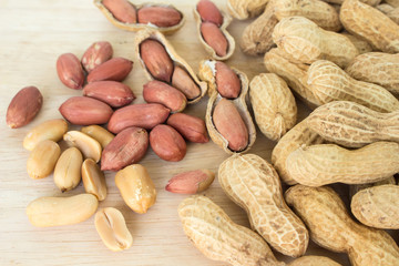 peanut pile on wooden background