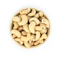cashew in white bowl top view on white background.