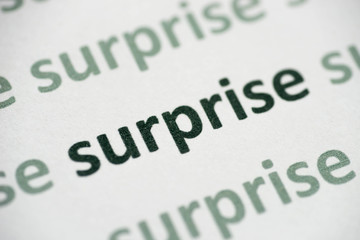 Fototapeta premium word surprise printed on paper macro