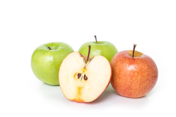 half red apple and green apple on white background.