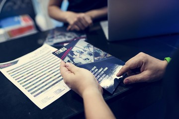 Hands holding fitness brochure