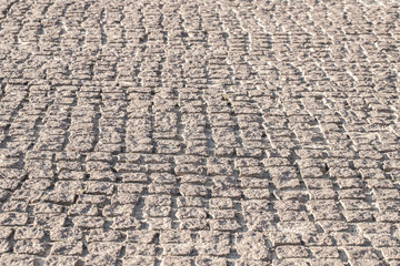 Old stone paved avenue street road, low angle