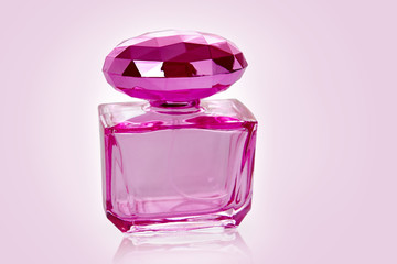 pink perfume bottle on a pink background