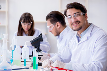 Team of chemists working in the lab