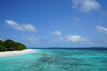 Fototapeta na wymiar View of a beautiful beach with turquoise water in Baa Atoll, Maldives