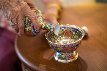 Buddhist's grail pouring water in thai celemony new home