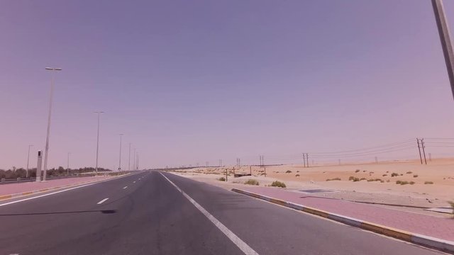 Four-way intersection with traffic lights on the highway in desert stock footage video
