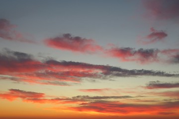 Obraz premium Beautiful pink orange sunset background in the sky