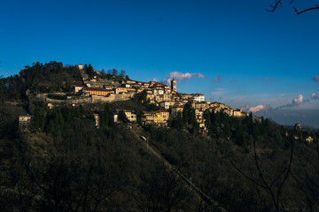 little town in the mountains village old with blue sky isolated