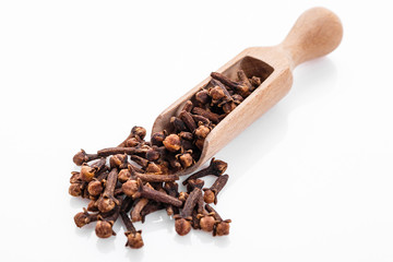 fragrant cloves on a white acrylic background