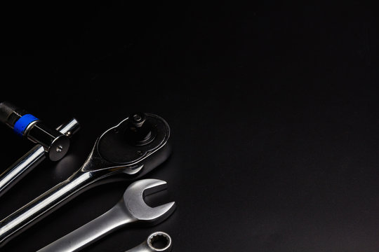 The wrench steel tools for repair on black background.