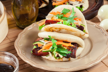 Gua bao, steamed buns with pork belly and vegetable