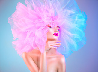 Fashion model woman in colorful bright lights posing, portrait of beautiful sexy girl with trendy makeup and colorful pink hairdo. Art design - obrazy, fototapety, plakaty