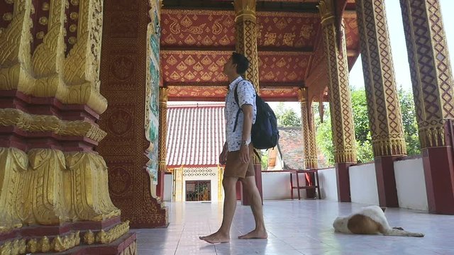 Backpacker Looking Wall's Temple