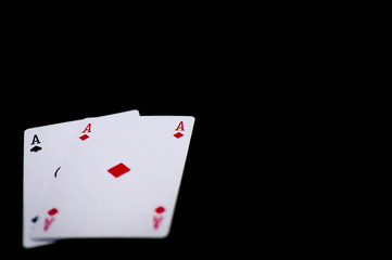 Pair of ases close up shot on dark background , space for text.