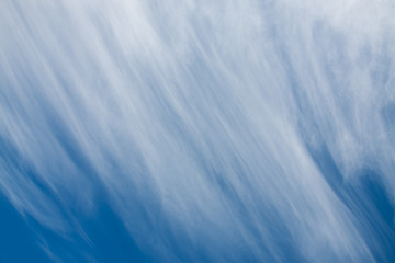 Cirrus clouds against the blue sky