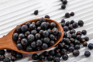 dried juniper berries on a white background
