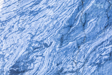 The background or texture of the marble wall of the quarry or opencast. The surface of the marble stone or rock