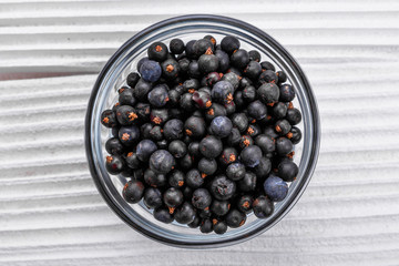 dried juniper berries on a white background