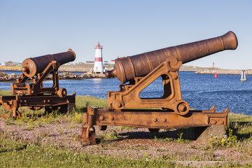 Old cannons and Saint Pierre Lighthouse