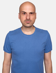 Fototapeta premium portrait of a grumpy man isolated