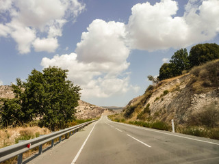 Empty road between hills