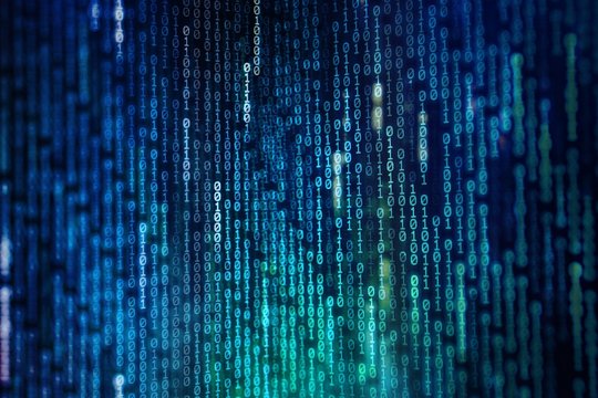 power of big data. binary code information bit on computer monitor screen display. Blue light text number one and zero. blur defocus blue bokeh light. technology graphic design background concepts