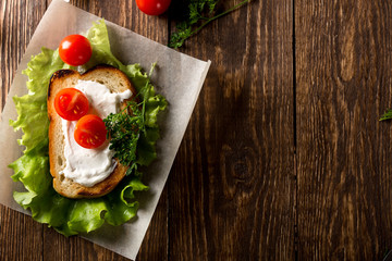 Homemade Burger with tomatoes and lettuce. Fast food.
