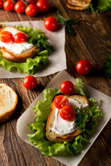 Homemade Burger with tomatoes and lettuce. Fast food.